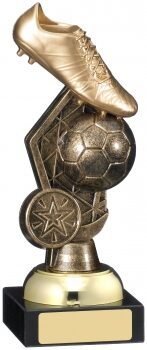 Antique gold football trophy featuring detailed football boot positioned above soccer ball with decorative stars, mounted on black base with gold engraving plate