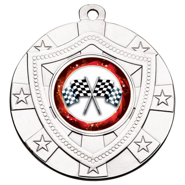 Silver 50mm shield medal displaying crossed black and white chequered racing flags in centre with red celestial background, featuring embossed star patterns and dotted border details with metal hanging loop at top