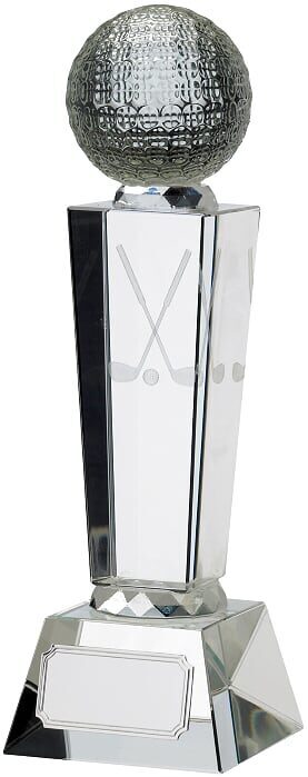 Tall crystal column trophy with metallic textured golf ball on top, featuring tapered crystal shaft with crossed golf clubs etching and substantial crystal base