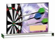 Rectangular printed glass plaque featuring a colourful dartboard with black and white segments, green and purple darts in flight, and yellow engraving plate, mounted on clear crystal base