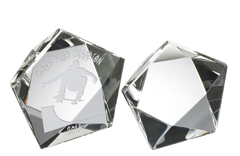 Pair of diamond-cut crystal paperweights with geometric multi-faceted surfaces, showing professional engraving and brilliant light refraction, premium award pieces