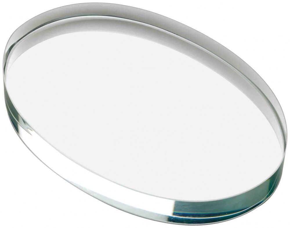 Premium oval crystal glass paperweight featuring bevelled edges and superior optical clarity, shown at an angle to highlight the sophisticated curved profile