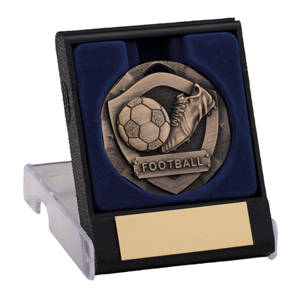 Bronze football medal featuring boot and ball design displayed in black presentation box with navy blue velvet lining and gold personalisation plate