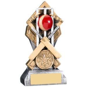 Contemporary cricket trophy with geometric bronze and silver shield design featuring a red cricket ball, star medallion and crossed decorative elements on a marble-effect base
