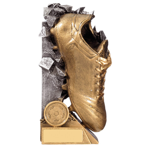 Football boot trophy featuring detailed golden football boot with laces emerging from black and silver shattered backdrop effect with football emblem and blank engraving plaque on base