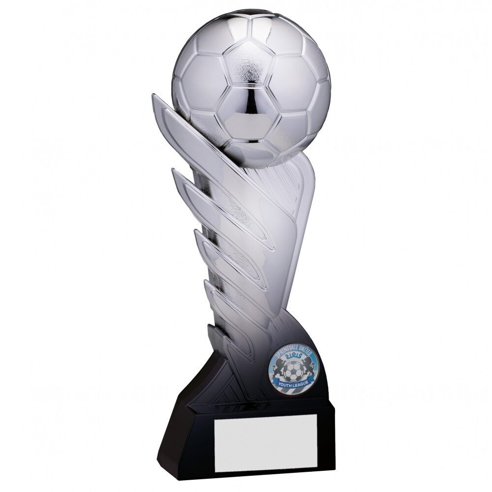 Silver football trophy with detailed 3D football on top of dramatic flame-effect column, featuring team badge holder and black engraving base