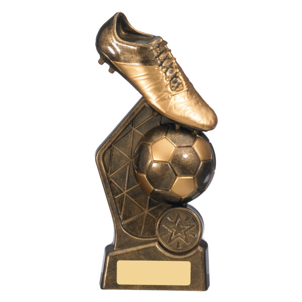 Golden football trophy featuring vertical tower design with detailed football boot and ball sculpture, geometric backdrop panel, star medallion, and engraving base plate