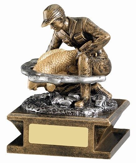 Bronze-effect fisherman trophy showing angler kneeling with landing net containing large fish, with water base effects and engraving plate
