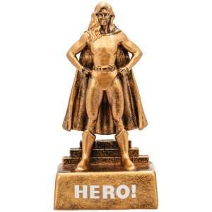 Golden bronze female superhero trophy displaying strong heroine figure in flowing cape with confident heroic pose, standing on base with HERO inscription and blank engraving plate