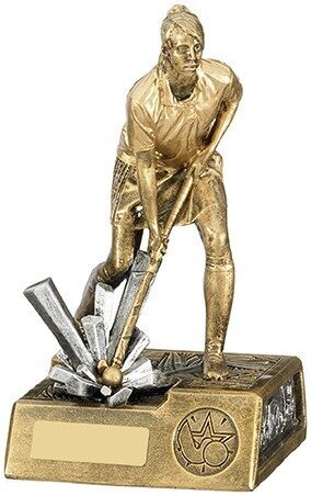 Bronze-finished female hockey player trophy showing woman in competitive hockey stance holding stick, mounted on detailed rectangular base with engraving area