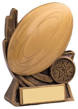 Rugby ball resin trophy with decorative boot design elements, rope detailing, bronze finish and gold engraving plate on wooden base