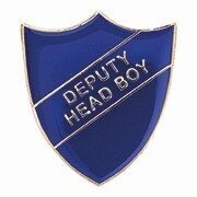 Blue shield-shaped enamel badge displaying DEPUTY HEAD BOY in white text on diagonal banner, with metal pin fastening for school uniform attachment