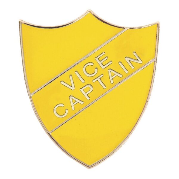 Yellow shield-shaped enamel pin badge with raised silver lettering spelling VICE CAPTAIN diagonally across the centre, featuring secure pin fastening on reverse
